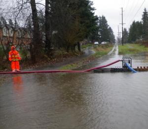 Surface Water Technician Art on-site at a severe flooding situation