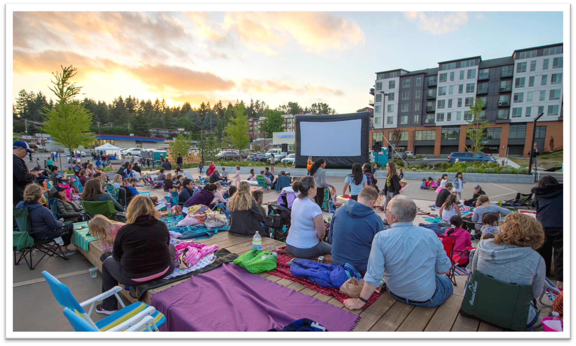 People watching an outdoor movie at Town Square